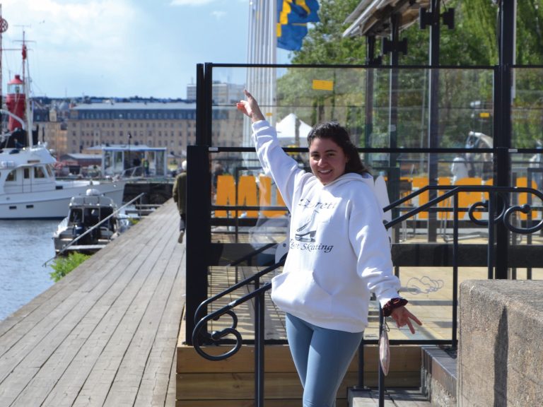 Janice stands by the water in Sweden